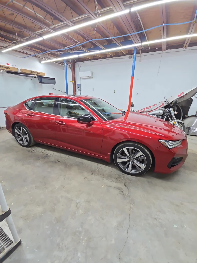 professional window tinting service being applied to a vehicle enhancing privacy and reducing heat in pensacola fl window tinting