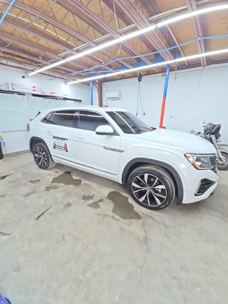 professional installation of window tinting on a vehicle enhancing privacy and reducing heat auto window tinting services