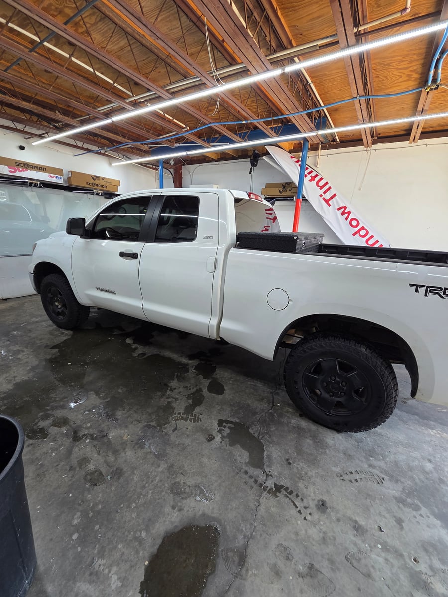 Automotive window tint installation on Toyota Tundra truck