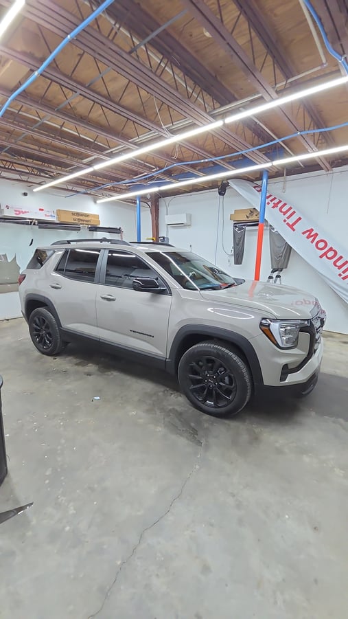 Automotive window tint installation on GMC Terrain SUV
